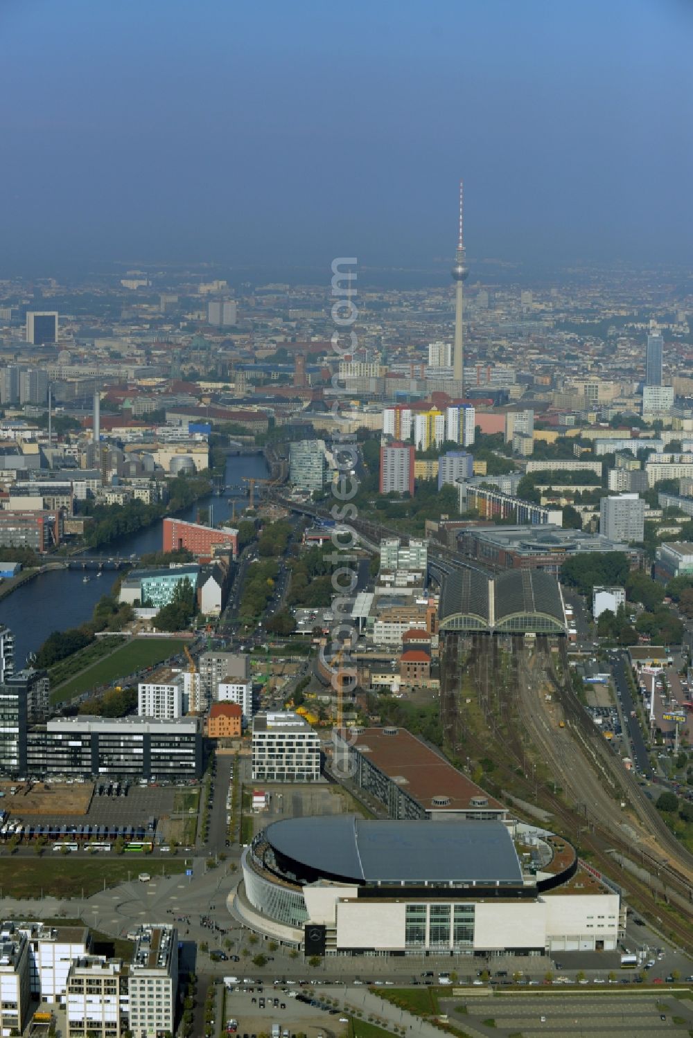 Berlin from above - Mercedes-Benz-Arena on the Spree riverbank in the Friedrichshain part of Berlin. The former O2 World - now Mercedes-Benz-Arena - is located in the Anschutz Areal, a business and office space on the riverbank