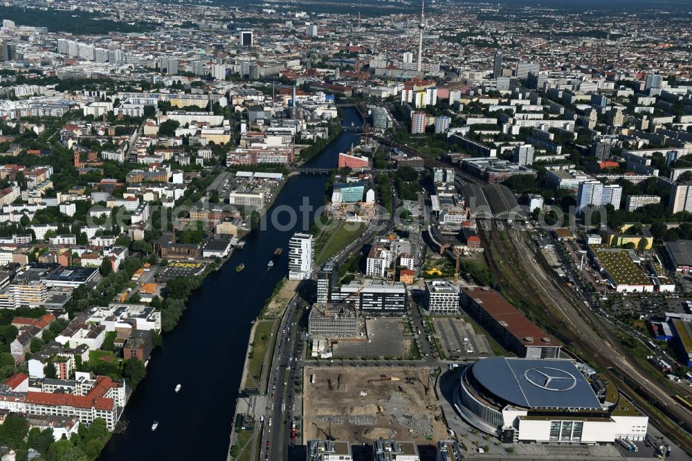 Berlin from above - Mercedes-Benz-Arena on the Spree riverbank in the Friedrichshain part of Berlin. The former O2 World - now Mercedes-Benz-Arena - is located in the Anschutz Areal, a business and office space on the riverbank