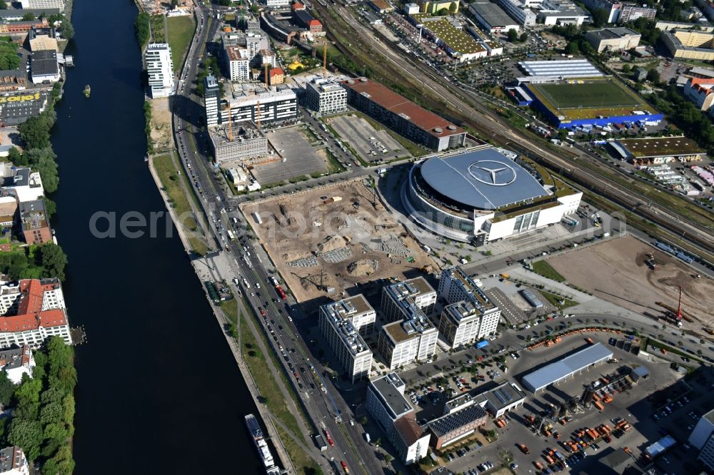 Berlin from above - Mercedes-Benz-Arena on the Spree riverbank in the Friedrichshain part of Berlin. The former O2 World - now Mercedes-Benz-Arena - is located in the Anschutz Areal, a business and office space on the riverbank