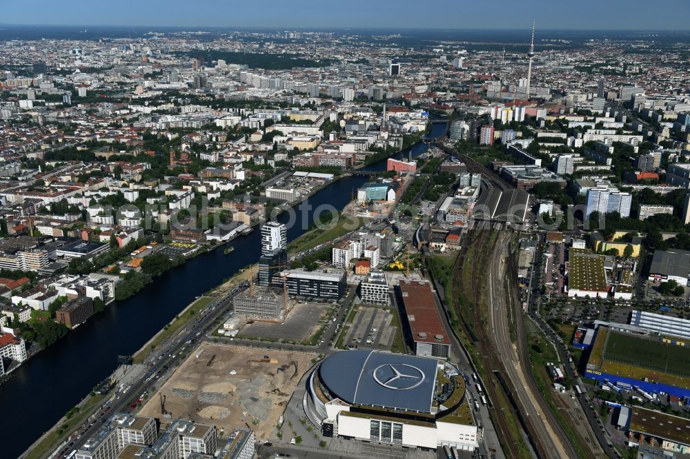 Berlin from above - Mercedes-Benz-Arena on the Spree riverbank in the Friedrichshain part of Berlin. The former O2 World - now Mercedes-Benz-Arena - is located in the Anschutz Areal, a business and office space on the riverbank