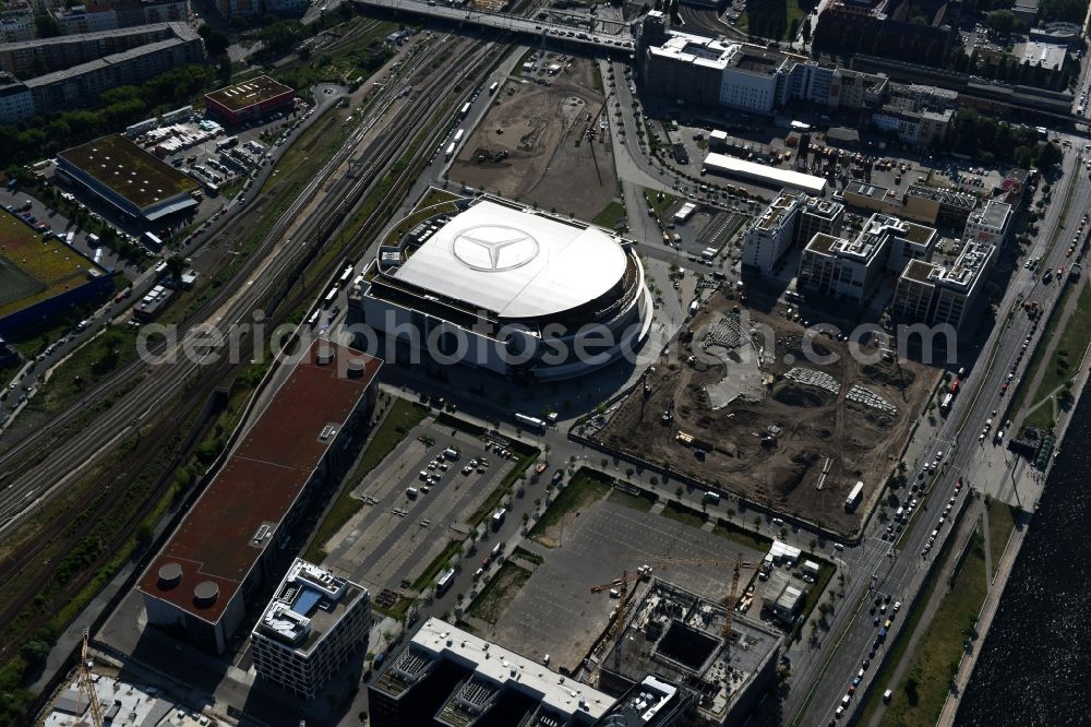 Berlin from above - Mercedes-Benz-Arena on the Spree riverbank in the Friedrichshain part of Berlin. The former O2 World - now Mercedes-Benz-Arena - is located in the Anschutz Areal, a business and office space on the riverbank