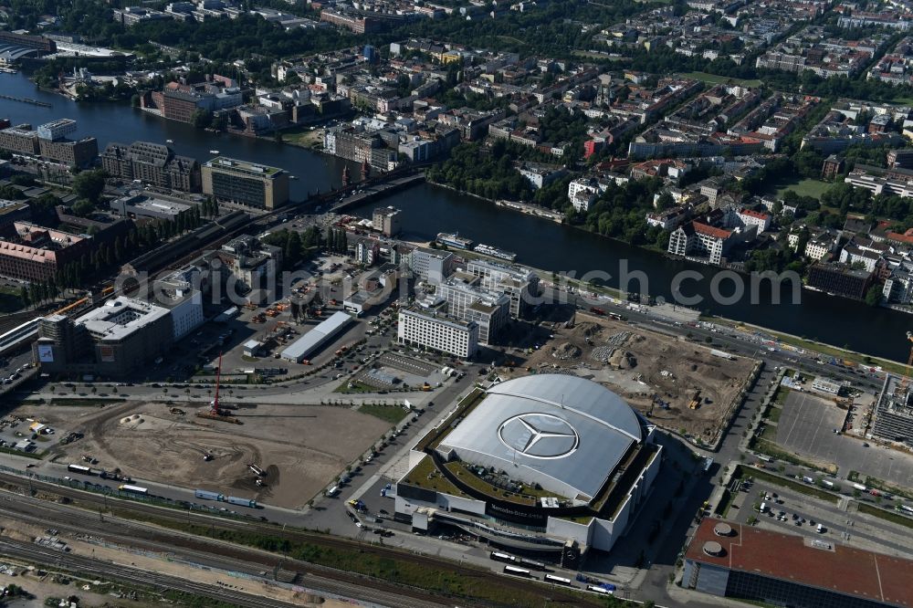 Berlin from above - Mercedes-Benz-Arena on the Spree riverbank in the Friedrichshain part of Berlin. The former O2 World - now Mercedes-Benz-Arena - is located in the Anschutz Areal, a business and office space on the riverbank