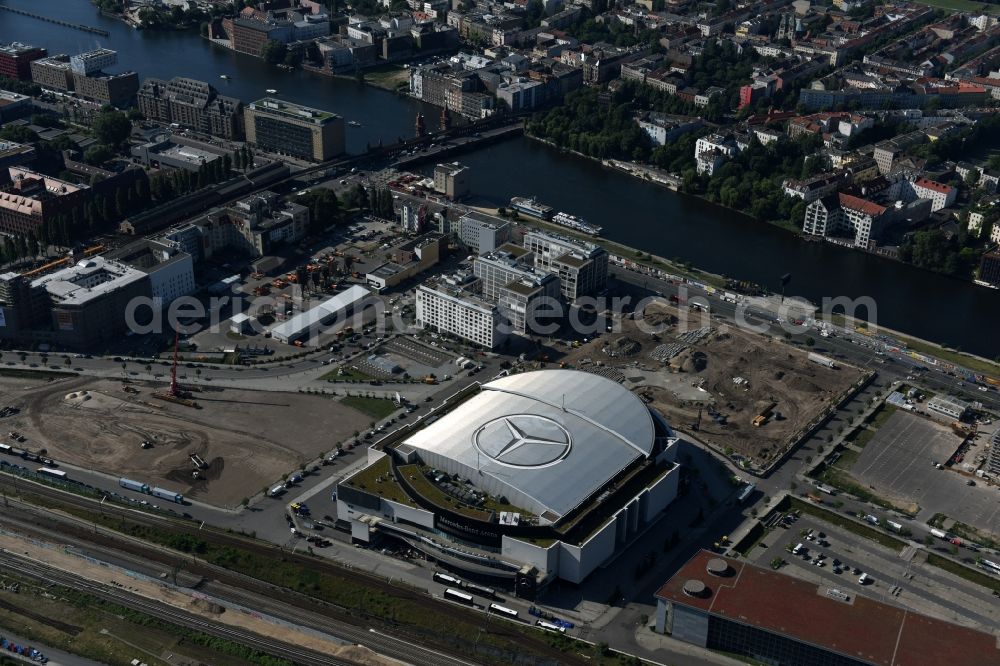 Berlin from the bird's eye view: Mercedes-Benz-Arena on the Spree riverbank in the Friedrichshain part of Berlin. The former O2 World - now Mercedes-Benz-Arena - is located in the Anschutz Areal, a business and office space on the riverbank