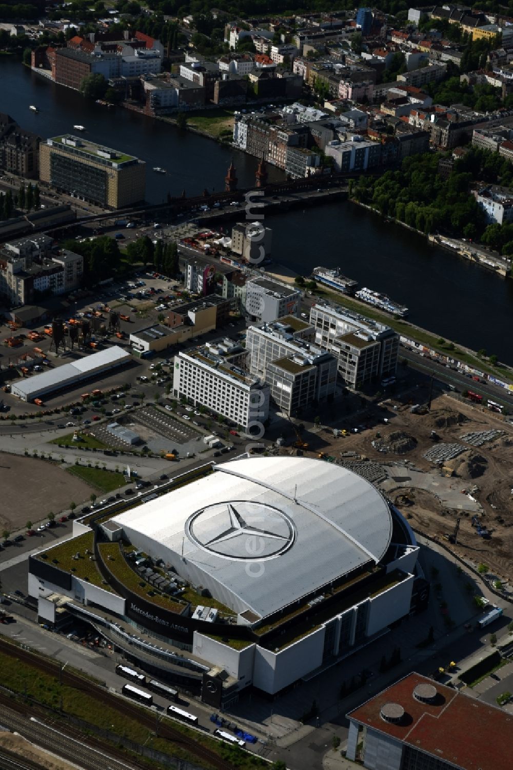 Aerial image Berlin - Mercedes-Benz-Arena on the Spree riverbank in the Friedrichshain part of Berlin. The former O2 World - now Mercedes-Benz-Arena - is located in the Anschutz Areal, a business and office space on the riverbank