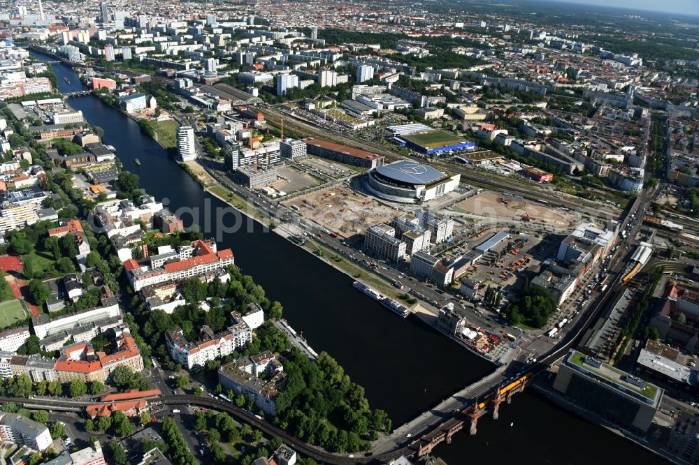 Berlin from above - Mercedes-Benz-Arena on the Spree riverbank in the Friedrichshain part of Berlin. The former O2 World - now Mercedes-Benz-Arena - is located in the Anschutz Areal, a business and office space on the riverbank