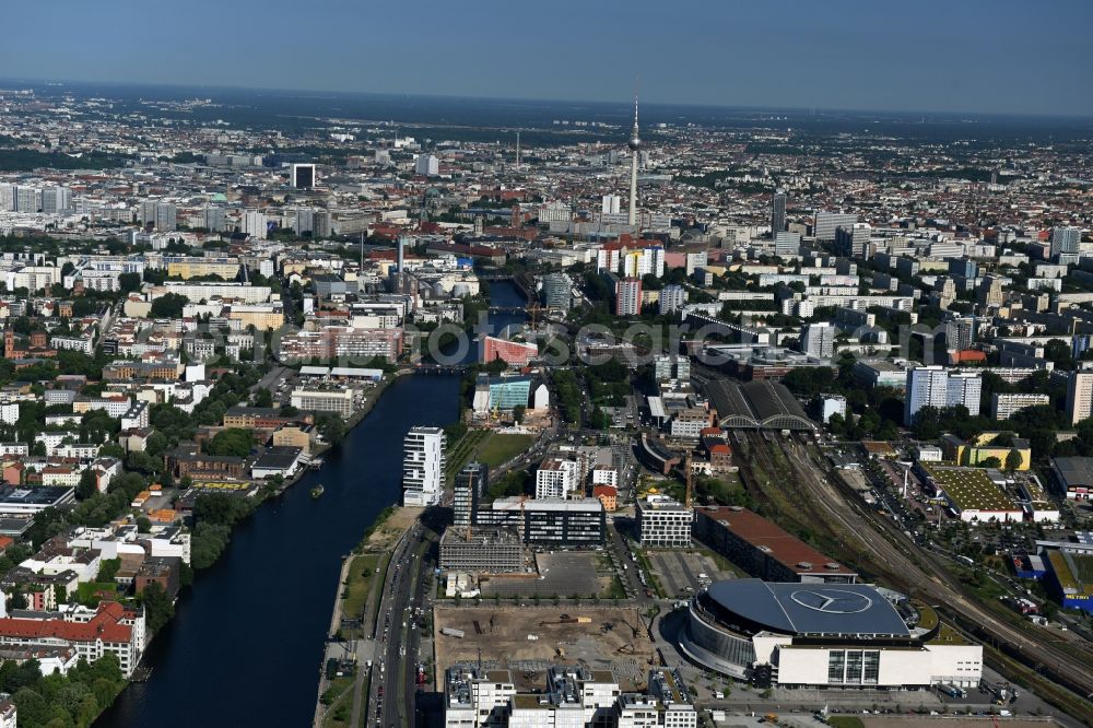 Berlin from above - Mercedes-Benz-Arena on the Spree riverbank in the Friedrichshain part of Berlin. The former O2 World - now Mercedes-Benz-Arena - is located in the Anschutz Areal, a business and office space on the riverbank