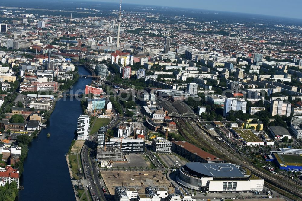 Berlin from above - Mercedes-Benz-Arena on the Spree riverbank in the Friedrichshain part of Berlin. The former O2 World - now Mercedes-Benz-Arena - is located in the Anschutz Areal, a business and office space on the riverbank