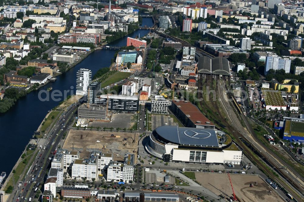 Berlin from above - Mercedes-Benz-Arena on the Spree riverbank in the Friedrichshain part of Berlin. The former O2 World - now Mercedes-Benz-Arena - is located in the Anschutz Areal, a business and office space on the riverbank