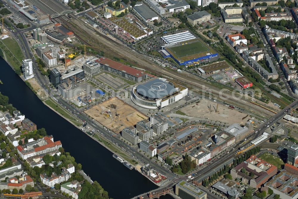 Berlin from above - Mercedes-Benz-Arena on the Spree riverbank in the Friedrichshain part of Berlin. The former O2 World - now Mercedes-Benz-Arena - is located in the Anschutz Areal, a business and office space on the riverbank