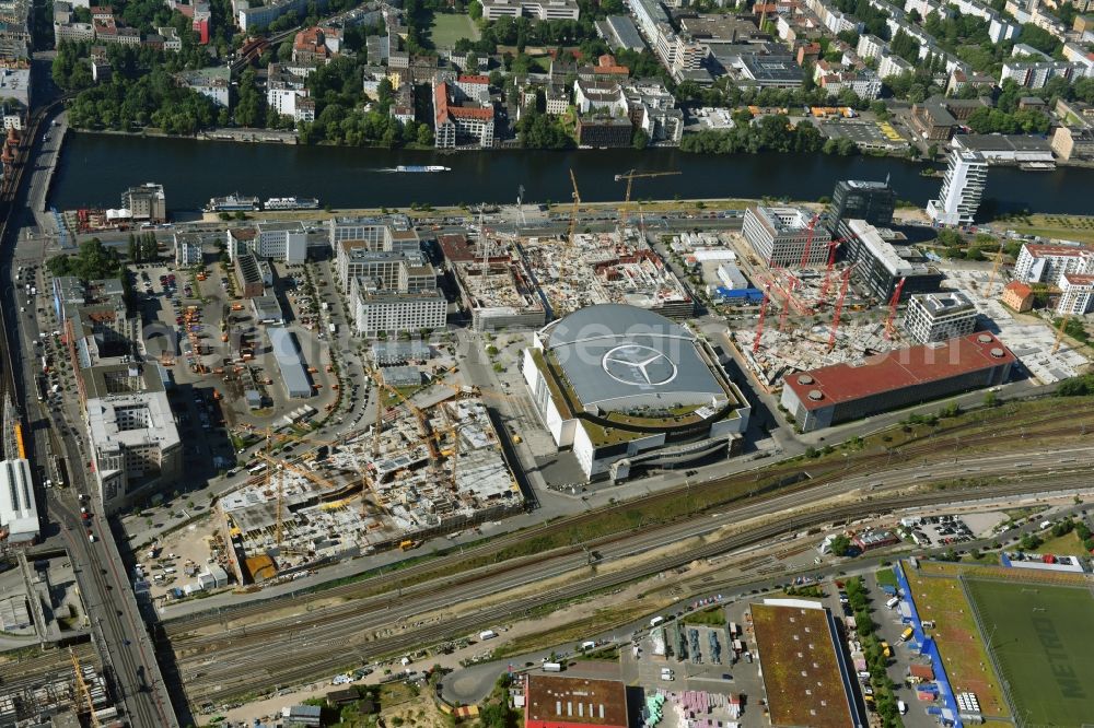 Berlin from the bird's eye view: Night view of Mercedes-Benz-Arena on the Spree riverbank in the Friedrichshain part of Berlin. The former O2 World - now Mercedes-Benz-Arena - is located in the Anschutz Areal, a business and office space on the riverbank