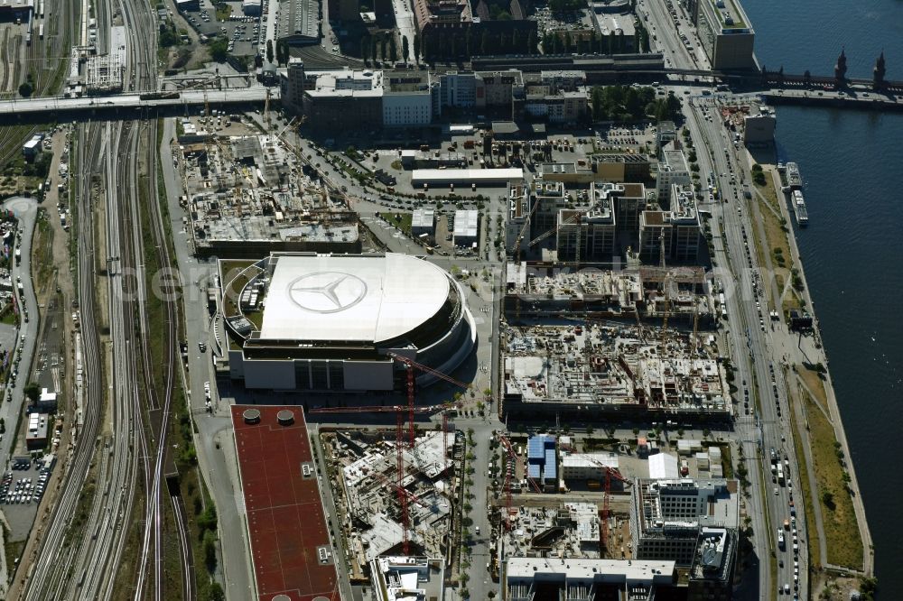 Berlin from the bird's eye view: Night view of Mercedes-Benz-Arena on the Spree riverbank in the Friedrichshain part of Berlin. The former O2 World - now Mercedes-Benz-Arena - is located in the Anschutz Areal, a business and office space on the riverbank