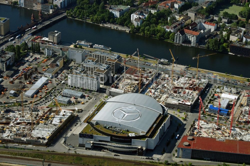 Berlin from above - Night view of Mercedes-Benz-Arena on the Spree riverbank in the Friedrichshain part of Berlin. The former O2 World - now Mercedes-Benz-Arena - is located in the Anschutz Areal, a business and office space on the riverbank