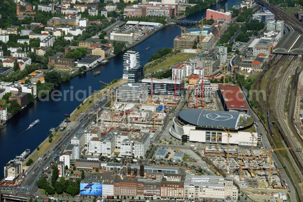 Berlin from above - Night view of Mercedes-Benz-Arena on the Spree riverbank in the Friedrichshain part of Berlin. The former O2 World - now Mercedes-Benz-Arena - is located in the Anschutz Areal, a business and office space on the riverbank