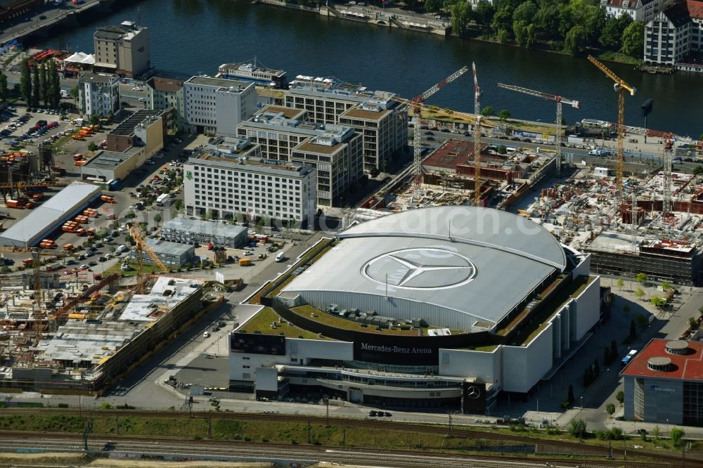 Aerial image Berlin - Night view of Mercedes-Benz-Arena on the Spree riverbank in the Friedrichshain part of Berlin. The former O2 World - now Mercedes-Benz-Arena - is located in the Anschutz Areal, a business and office space on the riverbank