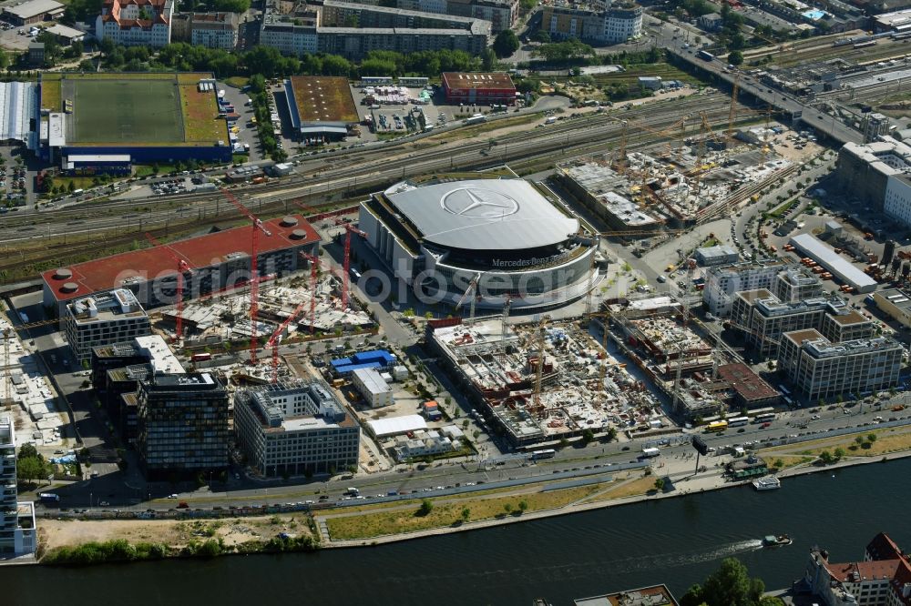 Berlin from the bird's eye view: Night view of Mercedes-Benz-Arena on the Spree riverbank in the Friedrichshain part of Berlin. The former O2 World - now Mercedes-Benz-Arena - is located in the Anschutz Areal, a business and office space on the riverbank