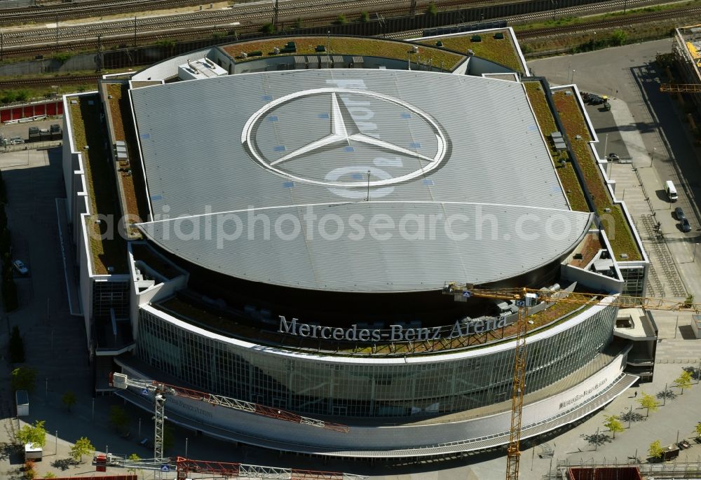 Berlin from above - Night view of Mercedes-Benz-Arena on the Spree riverbank in the Friedrichshain part of Berlin. The former O2 World - now Mercedes-Benz-Arena - is located in the Anschutz Areal, a business and office space on the riverbank