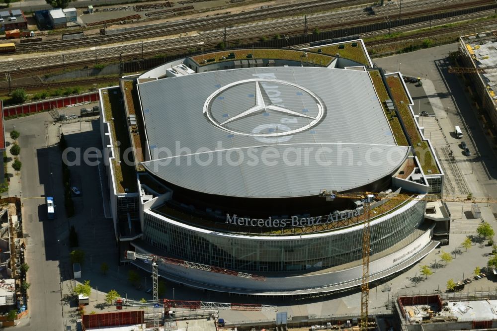 Berlin from the bird's eye view: Night view of Mercedes-Benz-Arena on the Spree riverbank in the Friedrichshain part of Berlin. The former O2 World - now Mercedes-Benz-Arena - is located in the Anschutz Areal, a business and office space on the riverbank