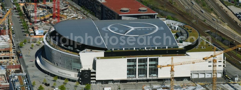 Aerial image Berlin - Night view of Mercedes-Benz-Arena on the Spree riverbank in the Friedrichshain part of Berlin. The former O2 World - now Mercedes-Benz-Arena - is located in the Anschutz Areal, a business and office space on the riverbank