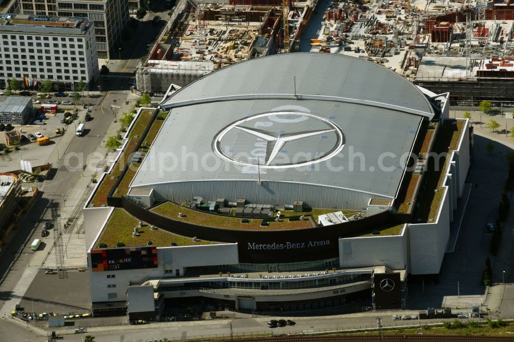 Berlin from the bird's eye view: Night view of Mercedes-Benz-Arena on the Spree riverbank in the Friedrichshain part of Berlin. The former O2 World - now Mercedes-Benz-Arena - is located in the Anschutz Areal, a business and office space on the riverbank