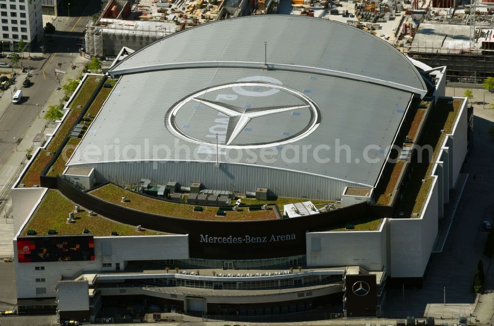 Aerial image Berlin - Night view of Mercedes-Benz-Arena on the Spree riverbank in the Friedrichshain part of Berlin. The former O2 World - now Mercedes-Benz-Arena - is located in the Anschutz Areal, a business and office space on the riverbank