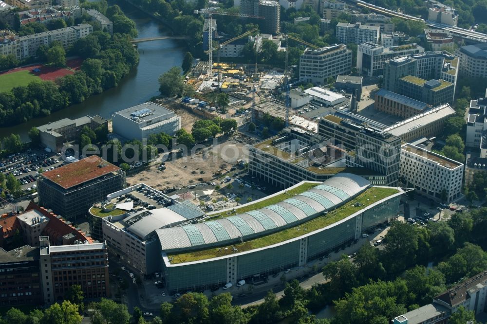 Berlin from above - The Mercedes-Benz Berlin branch is located on the Salzufer in Berlin-Charlottenburg. Here is the complete package will be offered to car buying and selling, financial services, and service.The building, also known as Mercedes World, follows with a sweep the barrel of the Landwehr Canal. Was built, the glass-steel construction according to designs by architects Lamb, Weber, Donath and partners