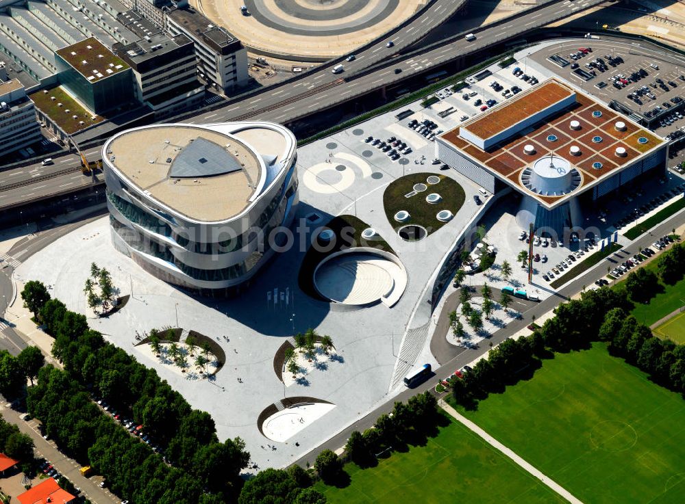 Aerial photograph Stuttgart - The Mercedes-Benz World is a customer service center of Daimler in Stuttgart-Bad Cannstatt. The concept for the museum expansion was developed by the Stuttgart HG Merz. On their way through the museum, visitors can experience a journey through 120 years of automotive history