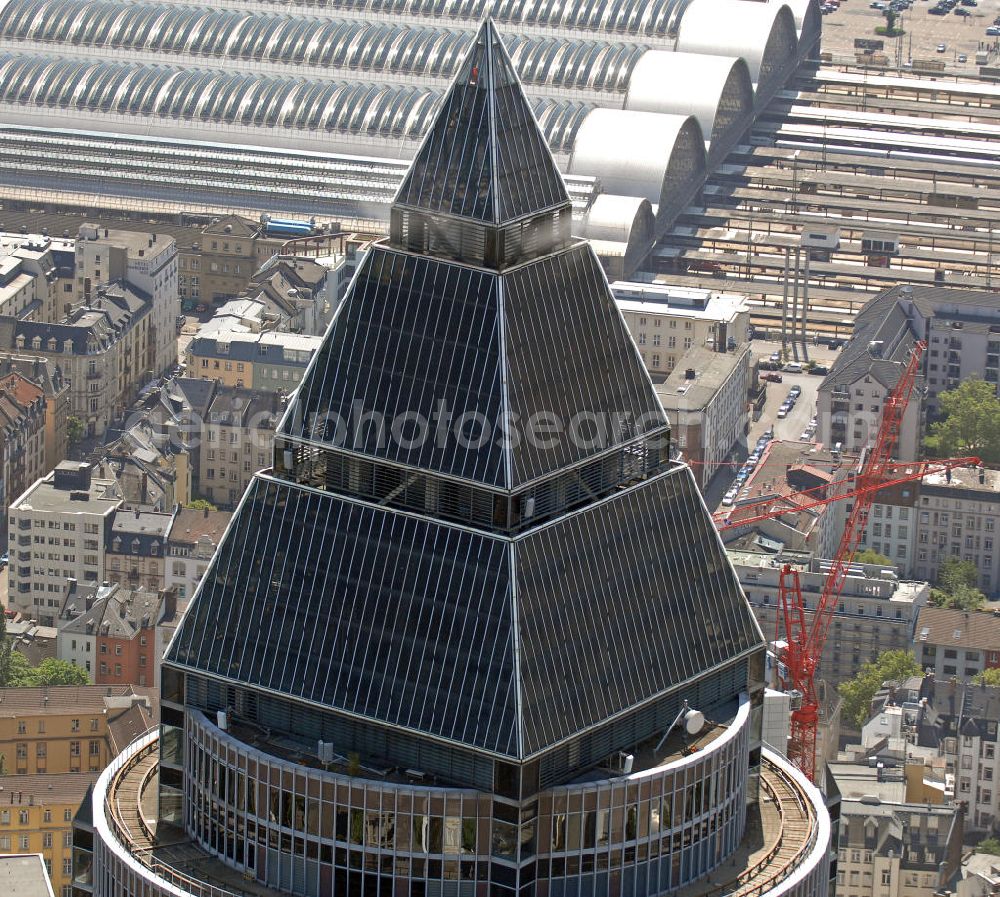 Frankfurt am Main from above - Blick auf den Messeturm in Frankfurt. Er hat eine Höhe von 257 m mit 55 Etagen und war bei seinem Bau 1991 das höchste Gebäude Europas. Die Pyramide auf dem Dach ist 36,6 m hoch. View on the Fair Tower in Frankfurt. It has a height of 257 meters with 55 floors and was at its construction in 1991, the highest building in Europe. The Pyramid on the roof is 36.6 m high.