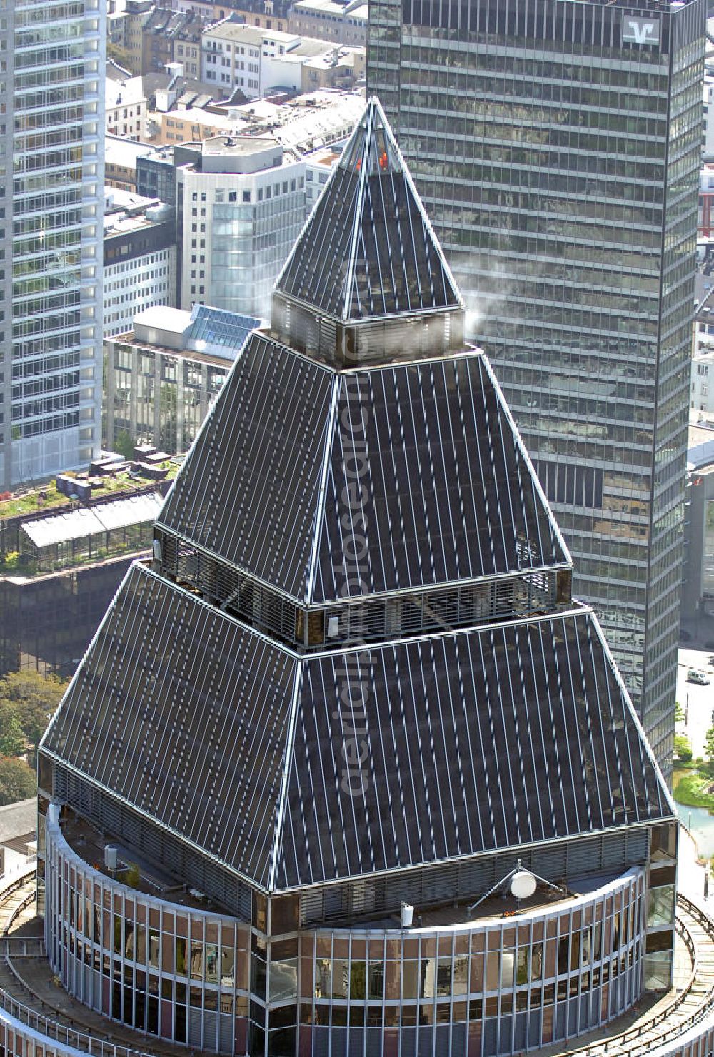 Frankfurt am Main from above - Blick auf den Messeturm in Frankfurt. Er hat eine Höhe von 257 m mit 55 Etagen und war bei seinem Bau 1991 das höchste Gebäude Europas. Die Pyramide auf dem Dach ist 36,6 m hoch. View on the Fair Tower in Frankfurt. It has a height of 257 meters with 55 floors and was at its construction in 1991, the highest building in Europe. The Pyramid on the roof is 36.6 m high.