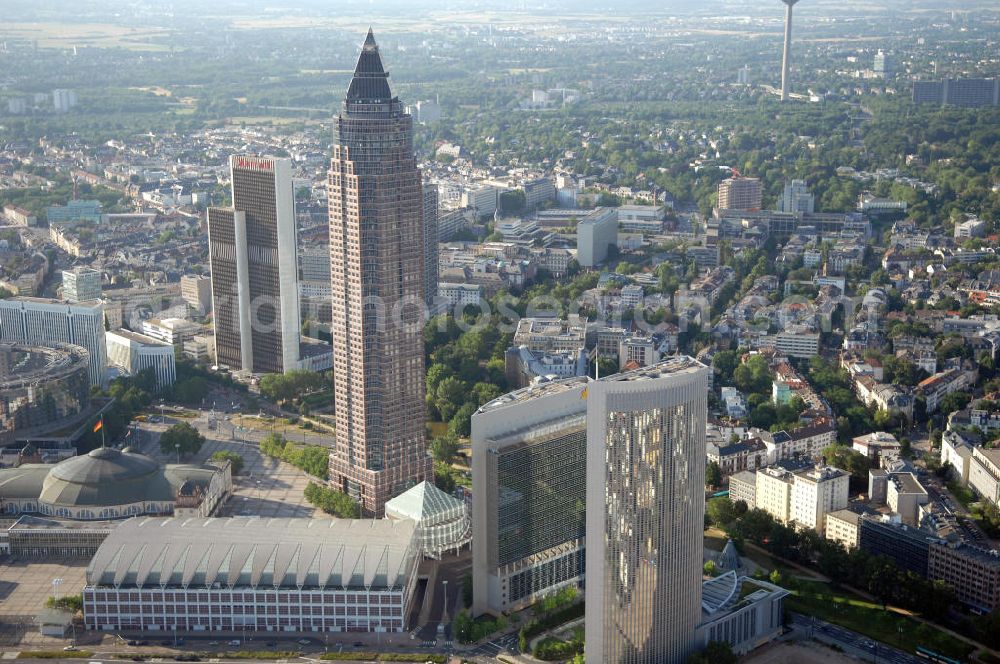 Aerial photograph Frankfurt am Main - Messeturm auf dem Messe- und Ausstellungsgelände Frankfurt auf der Friedrich-Ebert-Anlage 1. Ansprechpartner: Dr. Jens Schreiber Tel.: 69 75 75-66 22 - Telefax +49 69 75 75-68 44 press@messefrankfurt.com; Blick auf die beiden Frankfurter Hochhäuser Kastor und Pollux. Die ungleichen Zwillinge wurden nach den Dioskuren der griechischen Mythologie Kastor und Pollux benannt und wurden 1997 errichtet. Kastor & Pollux, Platz der Einheit 1, 60327 Frankfurt am Main; Regus GmbH & Co. KG, Komplementär: RegusVerwaltungs GmbH, Geschäftsführer: Mark Dixon, Anschrift: An der Welle 4, 60322 Frankfurt am Main, Hausanschrift: Prinzenallee 7, 40549 Düsseldorf, Tel. +49(0)211 52025 0, Fax +49(0)211 52025 370 Email: germany@regus.com