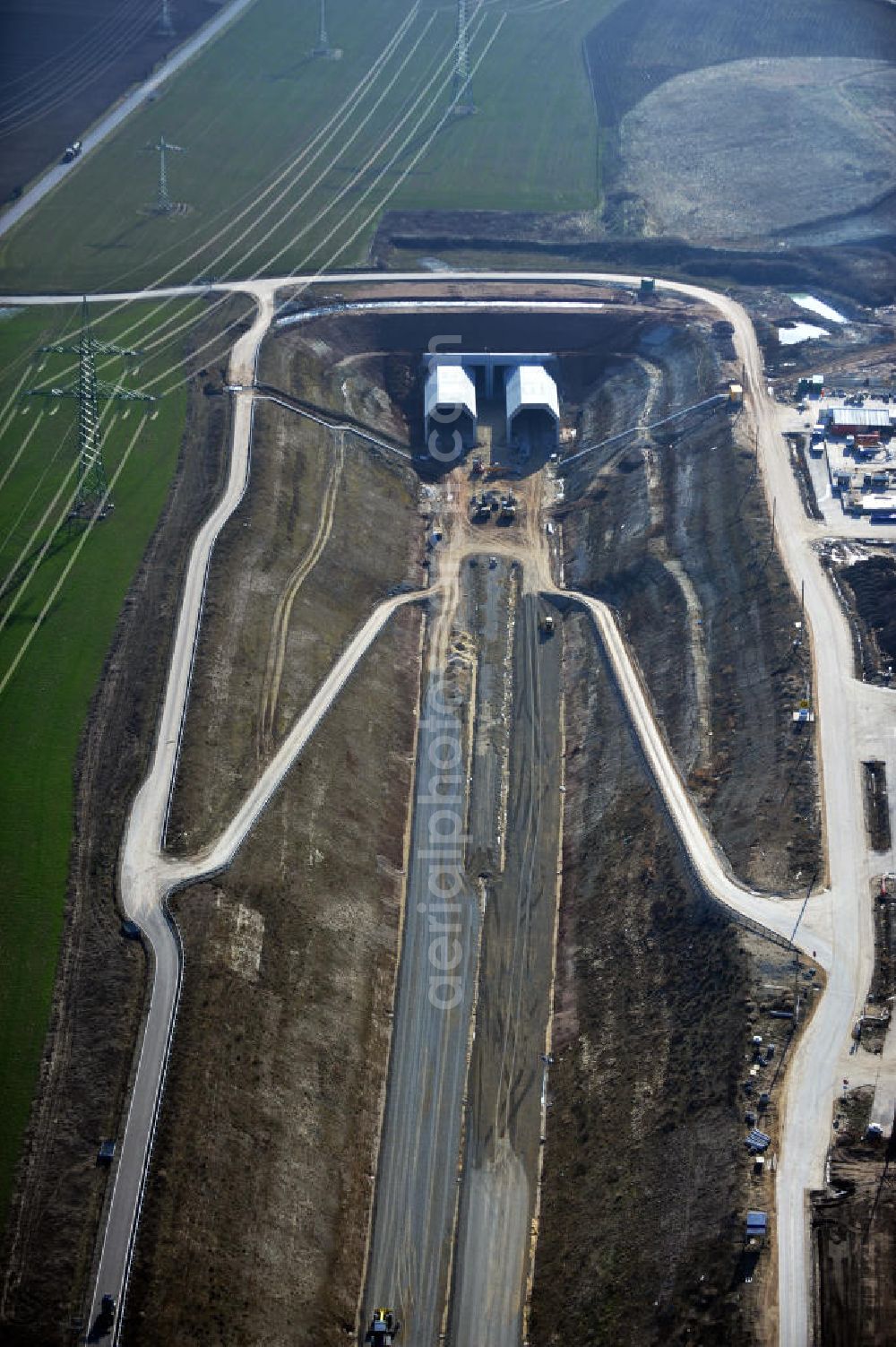 Aerial photograph Bad Bibra - View of the construction works at Bibra tunnel, a tunnel construction project by the Marti AG. The railway tunnel is created as a part of the German Unity Transport Project (VDE) No. 8. The building is created by spraying concrete with the inner shell in-situ concrete. The length of the two tunnels of the railway tracks will be 6466 meters. Client is the DB InfraGO AG