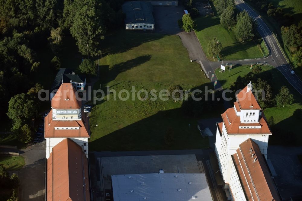 Aerial photograph Wurzen - The mill works on the mill race is an industrial monument, built between 1917 until 1925. The building is located in Wurzen in Saxony. The towers of the mill works are the landmarks of the city. Now home to the Wurzener Getreide AG