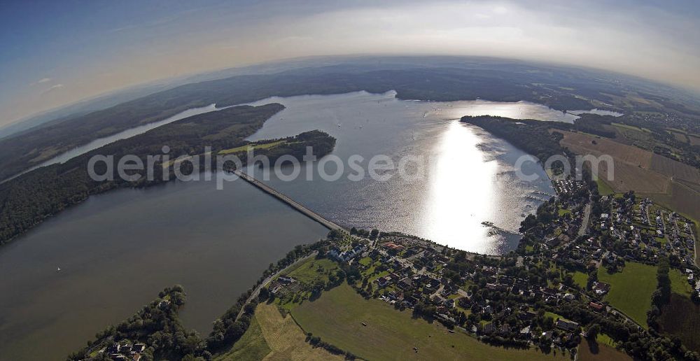 Möhnesee from the bird's eye view: Blick auf den Stausee der Möhnetalsperre während des Hochwassers 2007. Die Talsperre wurde zwischen 1908 und 1913 erbaut und umfasst rund 134,5 Millionen Kubikmeter Wasser. View of reservoir of the Moehne barrage during the flood 2007. The dam was built between 1908 and 1913 and the reservoir comprises approximately 134.5 million cubic meters of water.