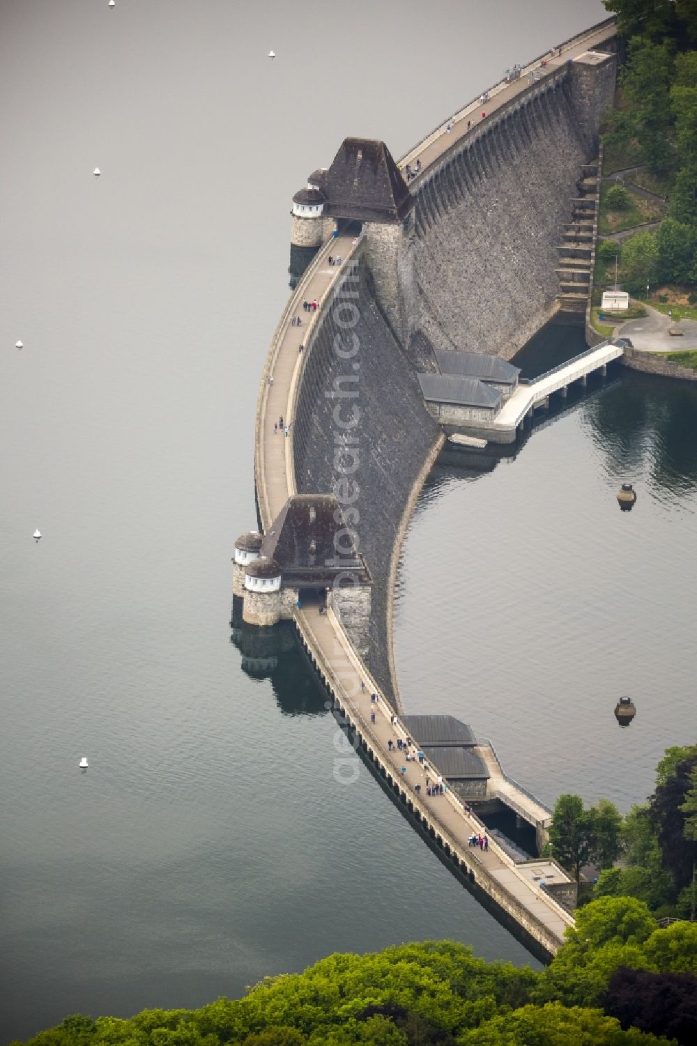 Möhnesee from above - Moehne Valley Dam in Moehnesee in the state of North Rhine-Westphalia. The dam is located in the North West of the Moehne barrier lake on the area of the borough and municipiality of Moehnsee in the Sauerland region