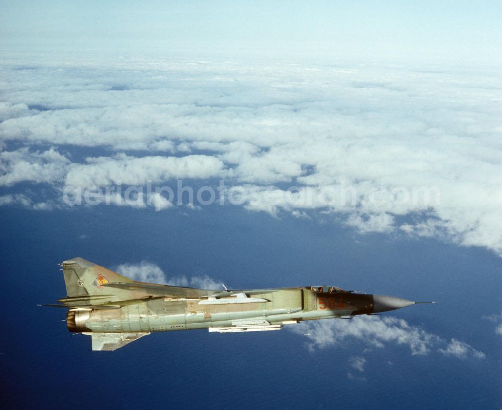 Peenemünde from above - Eine Jagdflugzeug Mig 23 der Luftstreitkräfte der NVA / Nationale Volksarmee über der Ostsee bei Peenemünde.