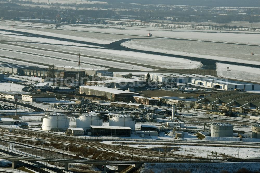 Aerial photograph Schönefeld - Snowy mineral oil - tanks on the airport area in winter in Schoenefeld in the state Brandenburg