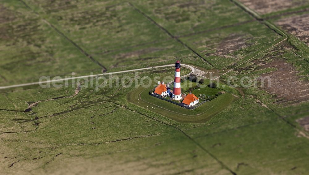 Westerhever from above - Miniature with Tiltshift - lighthouse as a historical navigation sign in the coastal area Westerheversand in the district of Hauert in Westerhever in the federal state Schleswig-Holstein