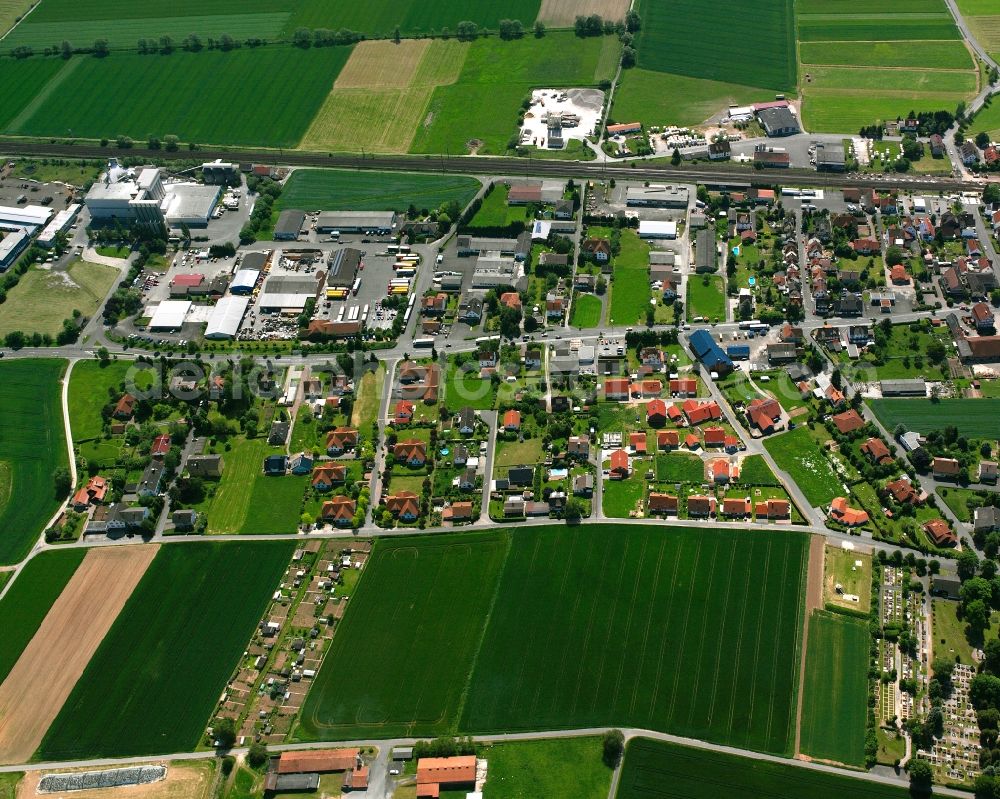 Heinebach from above - Mixing of residential and commercial settlements in Heinebach in the state Hesse, Germany