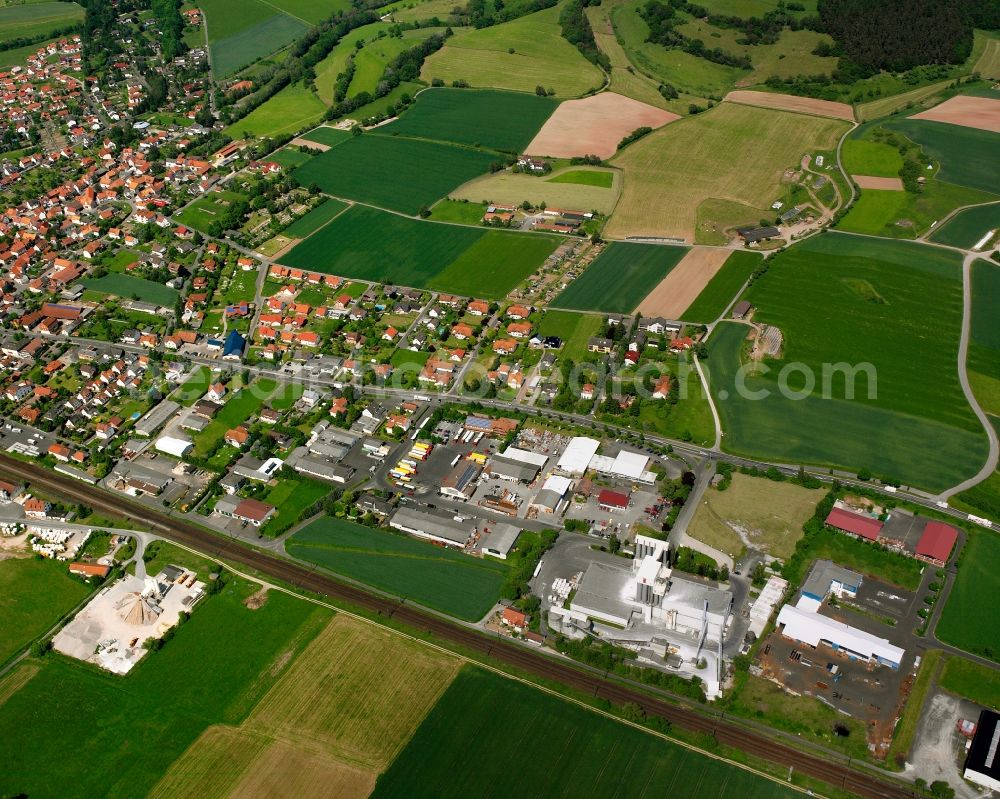 Heinebach from the bird's eye view: Mixing of residential and commercial settlements in Heinebach in the state Hesse, Germany