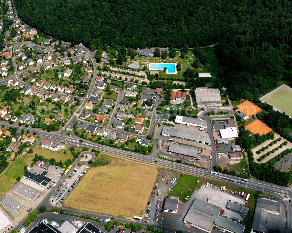 Lollar from above - Mixing of residential and commercial settlements on Schwimmbadstrasse in Lollar in the state Hesse, Germany