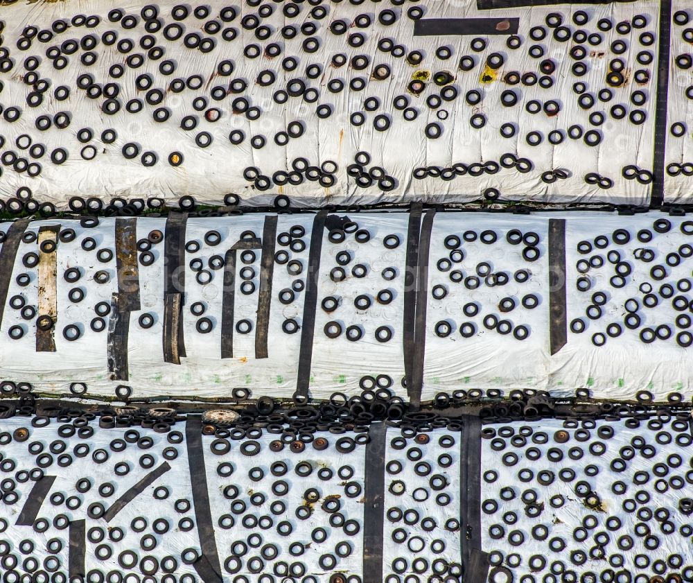 Eversberg from the bird's eye view: Tires on a drive-in and clamp silo in Eversberg in the state of North Rhine-Westphalia