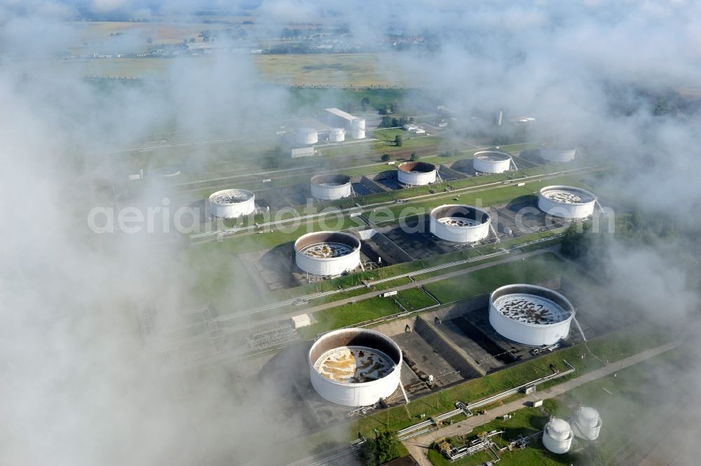 Seefeld from above - With morning mist covered fields petroleum tank farm in Seefeld