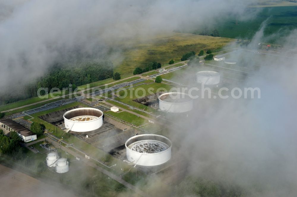Seefeld from above - With morning mist covered fields petroleum tank farm in Seefeld