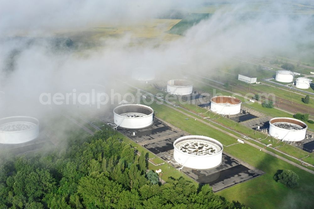 Seefeld from the bird's eye view: With morning mist covered fields petroleum tank farm in Seefeld