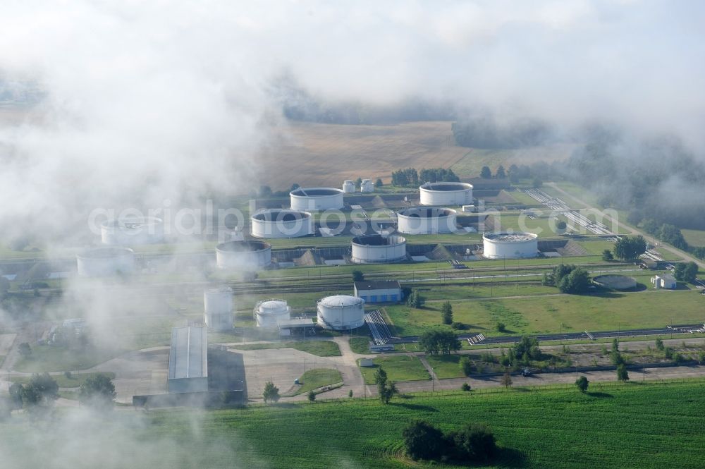 Seefeld from the bird's eye view: With morning mist covered fields petroleum tank farm in Seefeld