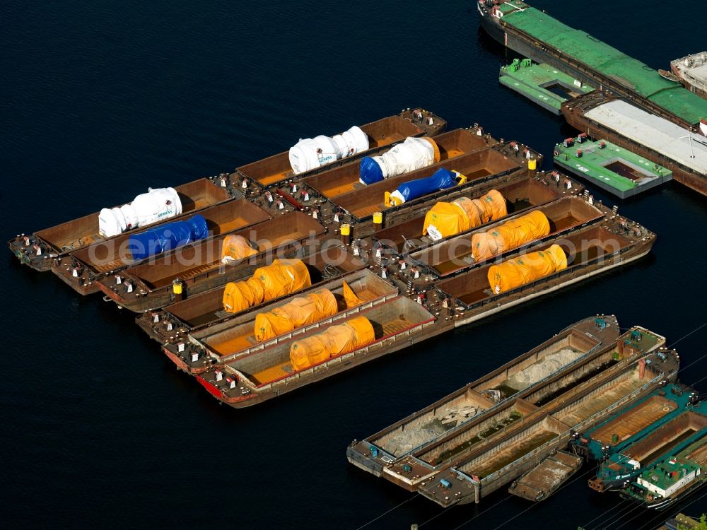 Berlin from the bird's eye view: With power plant turbines laden cargo ships on inland waterways on the Rummelsburger lake in Berlin Rummelsburg