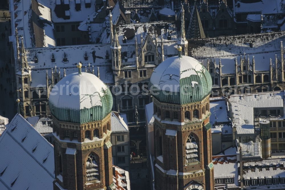 Aerial image München - With snow-covered roof domes of the church- towers Frauenkirche in the center of Munich in Bavaria