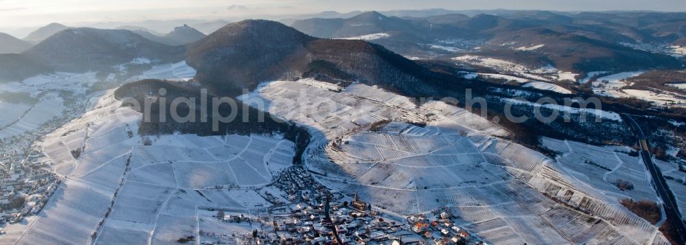 Birkweiler from above - Fields of wine cultivation landscape Kastanienbusch in Wine-village Birkweiler covered with snow at the German Wine-Street in the state Rhineland-Palatinate