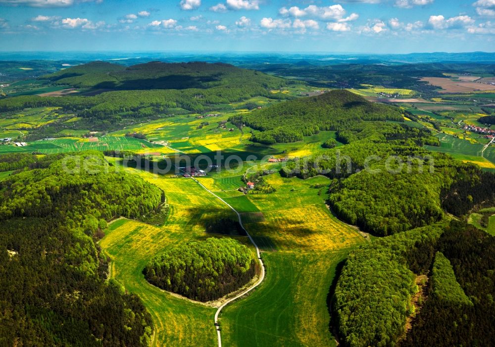 Aerial image Bermbach - Forest and mountain landscape of the mid-mountain range Thueringische Rhoen in Bermbach in the state Thuringia, Germany