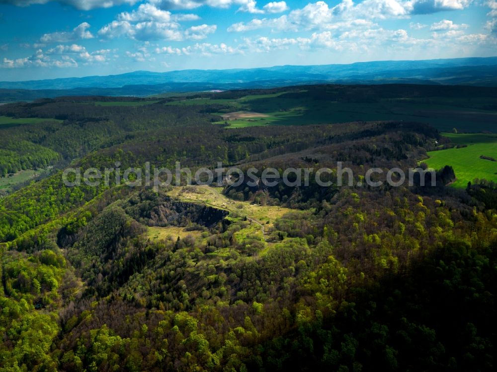 Bermbach from above - Forest and mountain landscape of the mid-mountain range Thueringische Rhoen in Bermbach in the state Thuringia, Germany