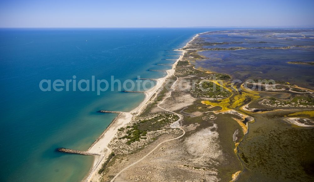 Saintes-Maries-de-la-Mer from the bird's eye view: Mediterranean coast landscape on the beach at Saintes-Maries-de-la-Mer, Provence-Alpes-Cote d'Azur in France